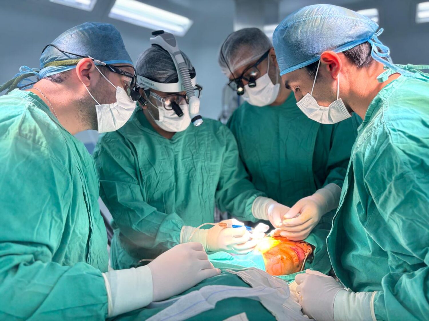 Dr. Ramirez operating with his surgical team in the hospital operating room